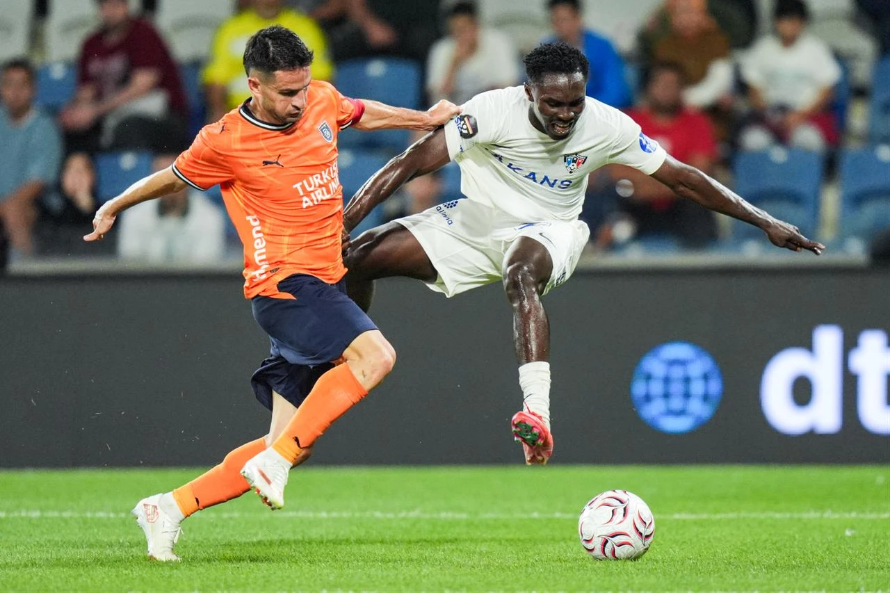 Omer Ali Sahiner (L) of Istanbul Basaksehir vies for the ball with Clinton Jephta (R) of Inter Turku during the first leg match of the UEFA Conference League second qualifying round at Basaksehir Fatih Terim Stadium in Istanbul, Türkiye, on July 22, 2026. (AA Photo)