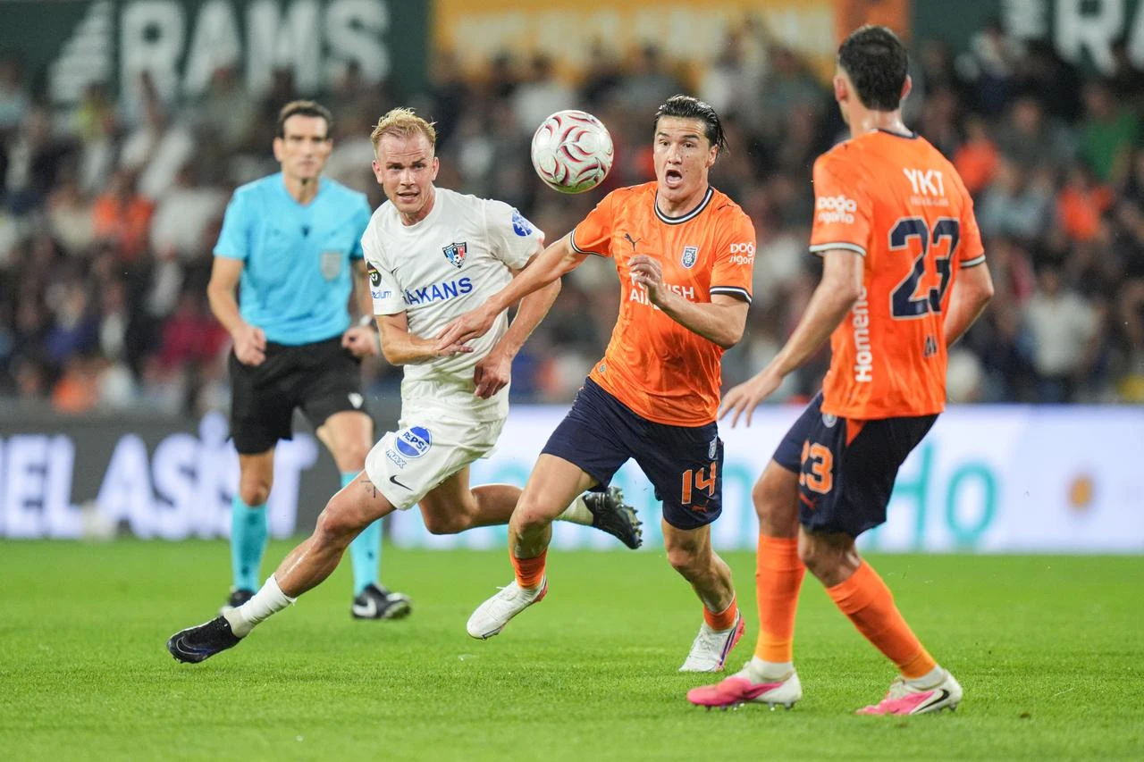 Eldor Shomurodov (14) of Istanbul Basaksehir in action against Jasse Tuominen (L) of Inter Turku during the UEFA Conference League second qualifying round first-leg match against Inter Turku at Basaksehir Fatih Terim Stadium in Istanbul, Türkiye, on July 22, 2026. (AA Photo)