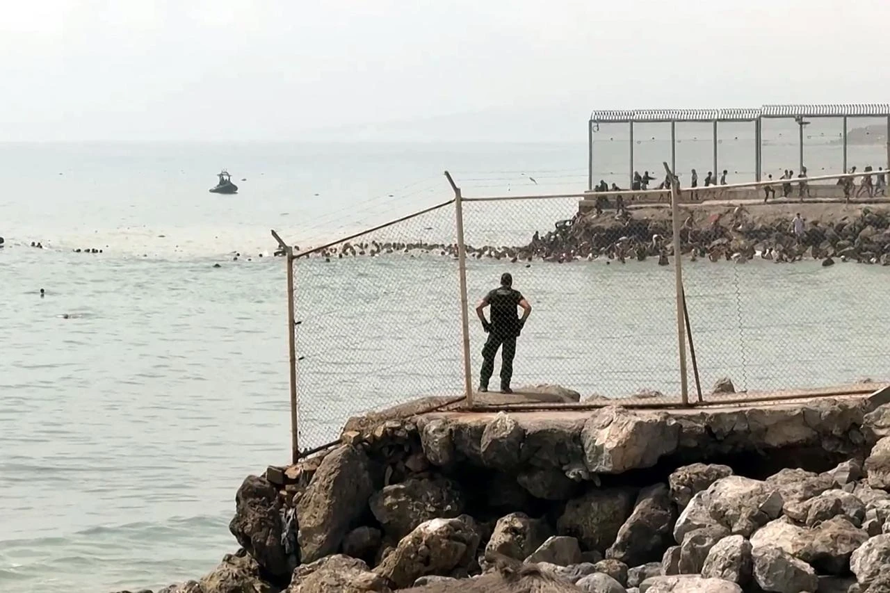 Spain sends troops to Ceuta after 1,500 migrants arrive in surge from Morocco