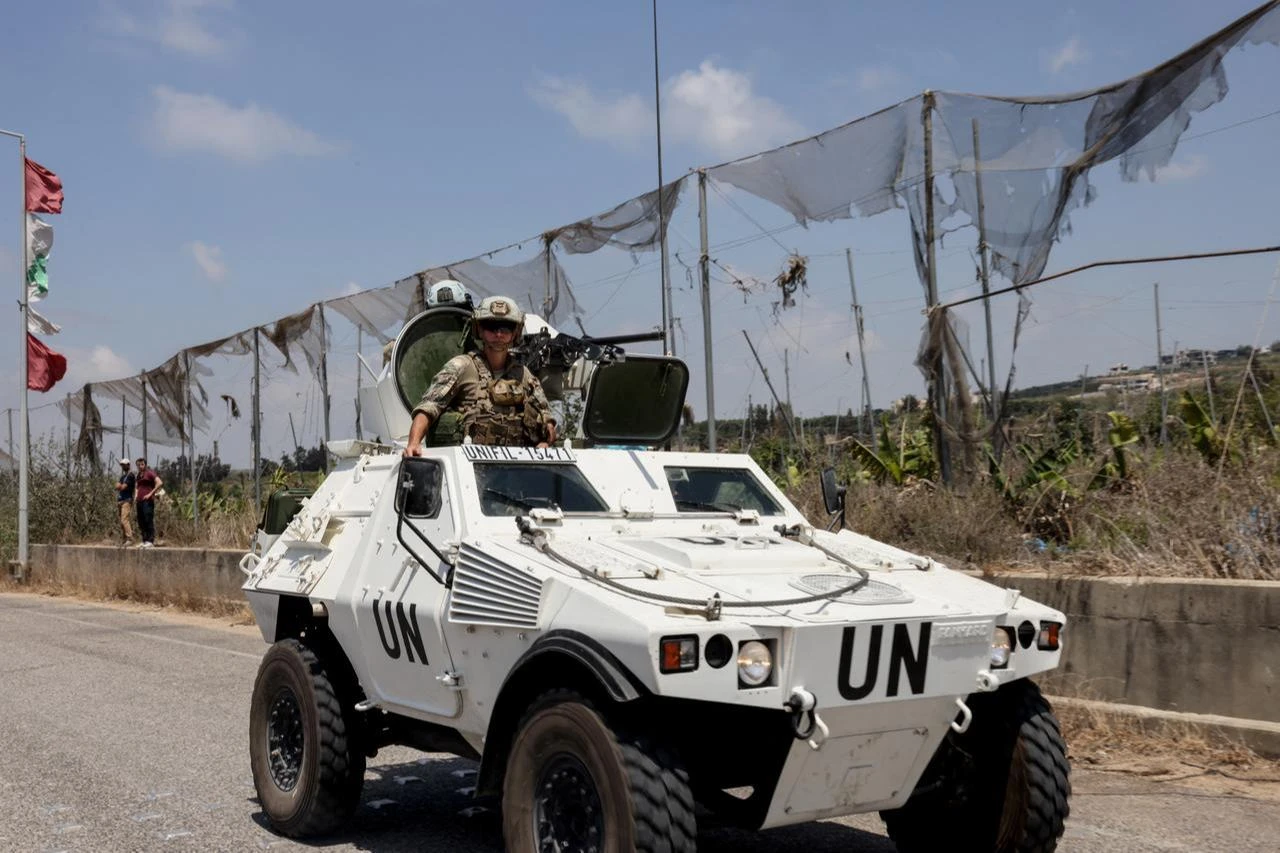 A photograph taken during a media tour shows a French peacekeeper (R) of the United Nations Interim Force in Lebanon (UNIFIL) patrolling near the southern Lebanese village of Biout es Sayed, July 20, 2026. (AFP Photo)