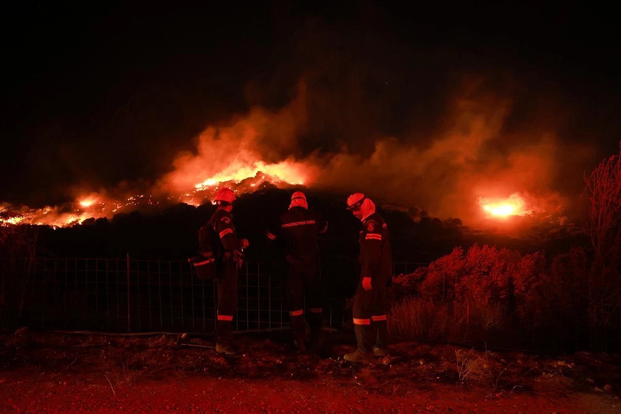 Firefighters battle a wildfire burning near the village of Preveli in the Rethymno region on the island of Crete, Greece, on July 30, 2026. (AA Photo)