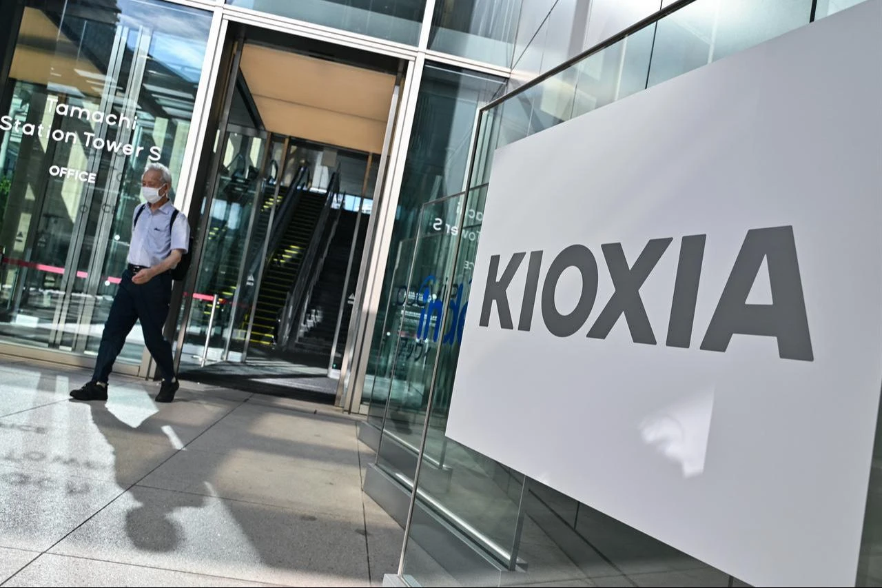 A man walks out of the building where the headquarters of Kioxia, the world's third largest manufacturer of NAND flash memory chips, is located in central Tokyo, August 23, 2024. (AFP Photo)