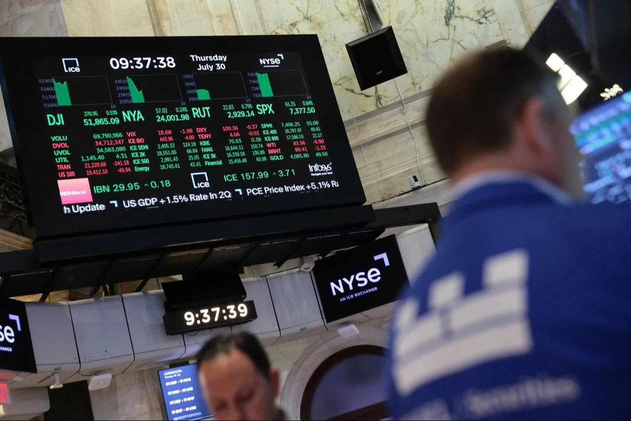 Stock market numbers are displayed on the floor of the New York Stock Exchange during morning trading on July 30, 2026, in New York City. (AFP Photo)