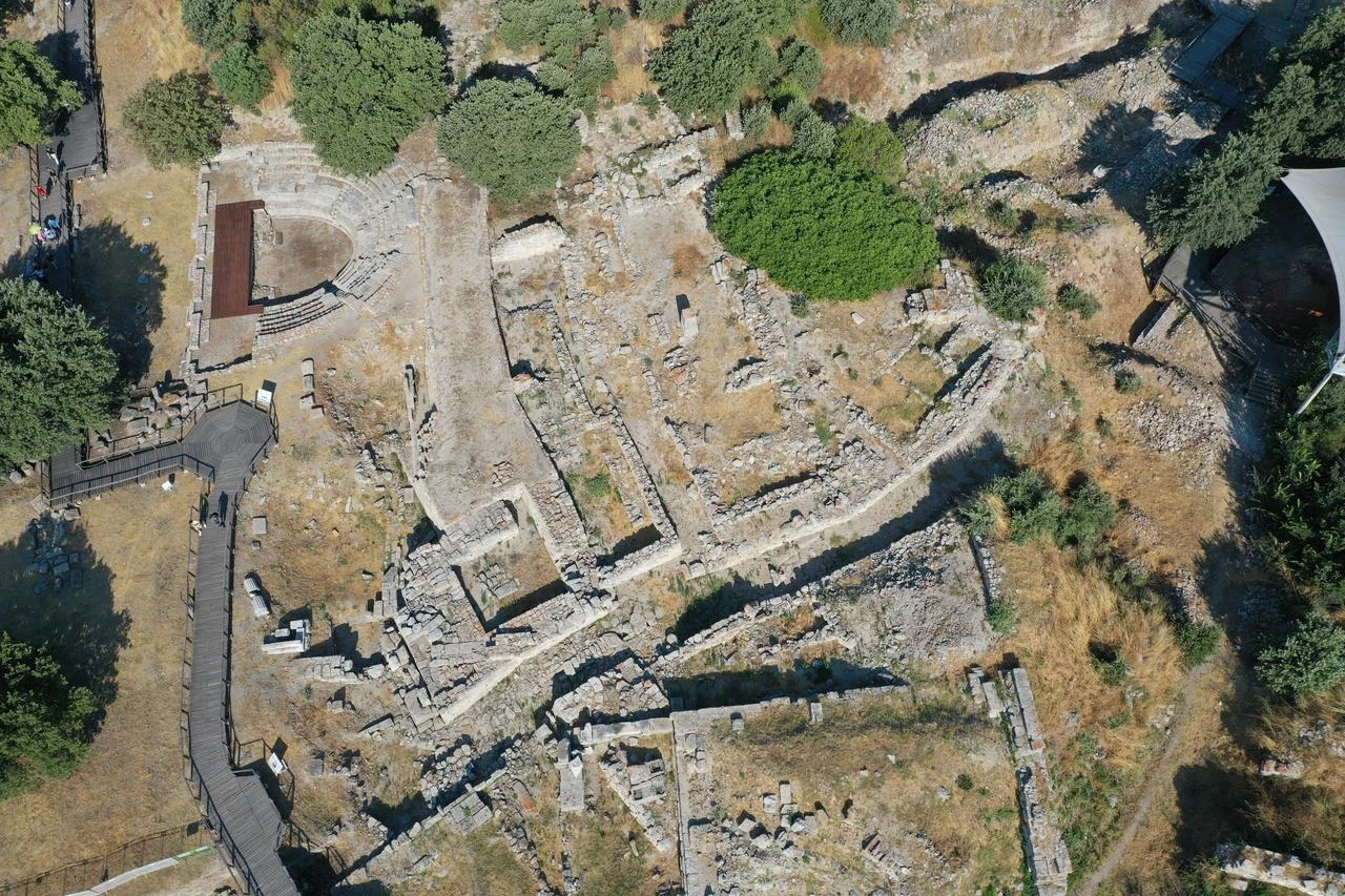 An aerial view shows ancient structures, including a small theater, at the archaeological site of Troy in Çanakkale, Türkiye, July 31, 2026. (AA Photo)