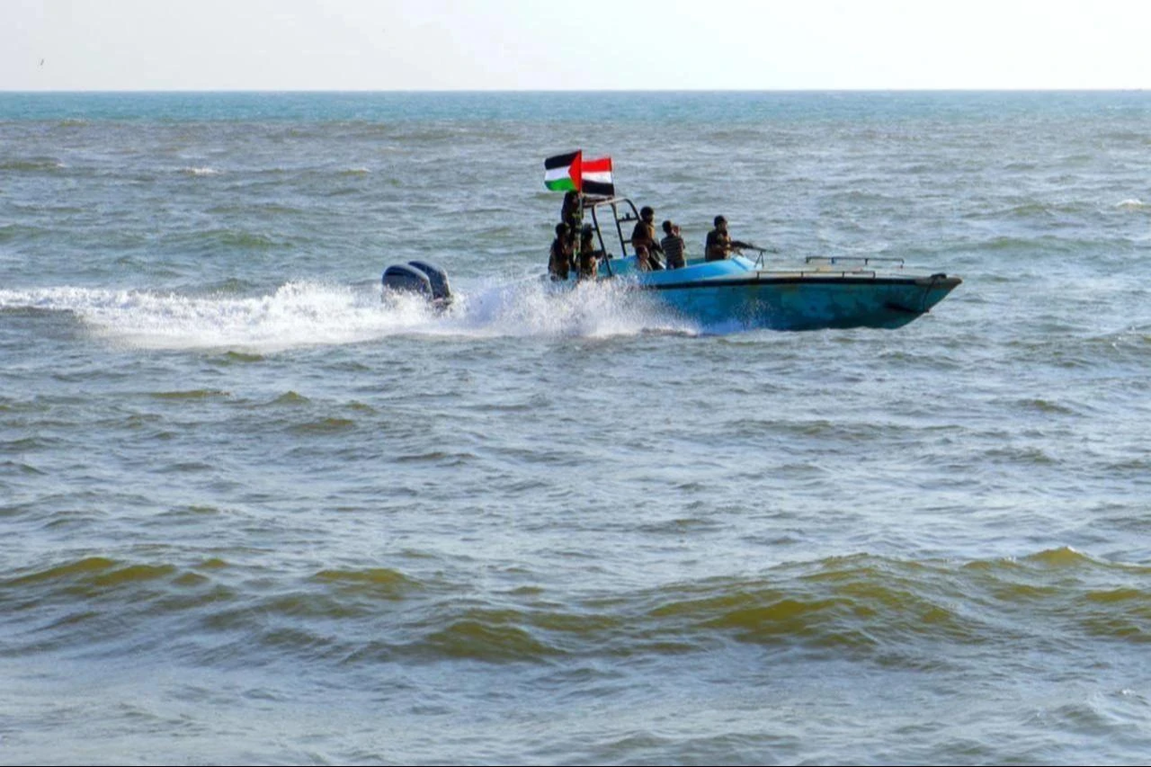 Members of the Yemeni Coast Guard affiliated with the Houthis patrol the sea as demonstrators march through the Red Sea port city of Hodeida, January 4, 2024. (AFP Photo)