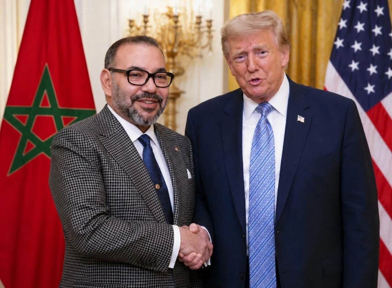 U.S. President Donald Trump shakes hands with King Mohammed VI of Morocco during a meeting at the White House to discuss regional security and economic cooperation. (Photo via X)