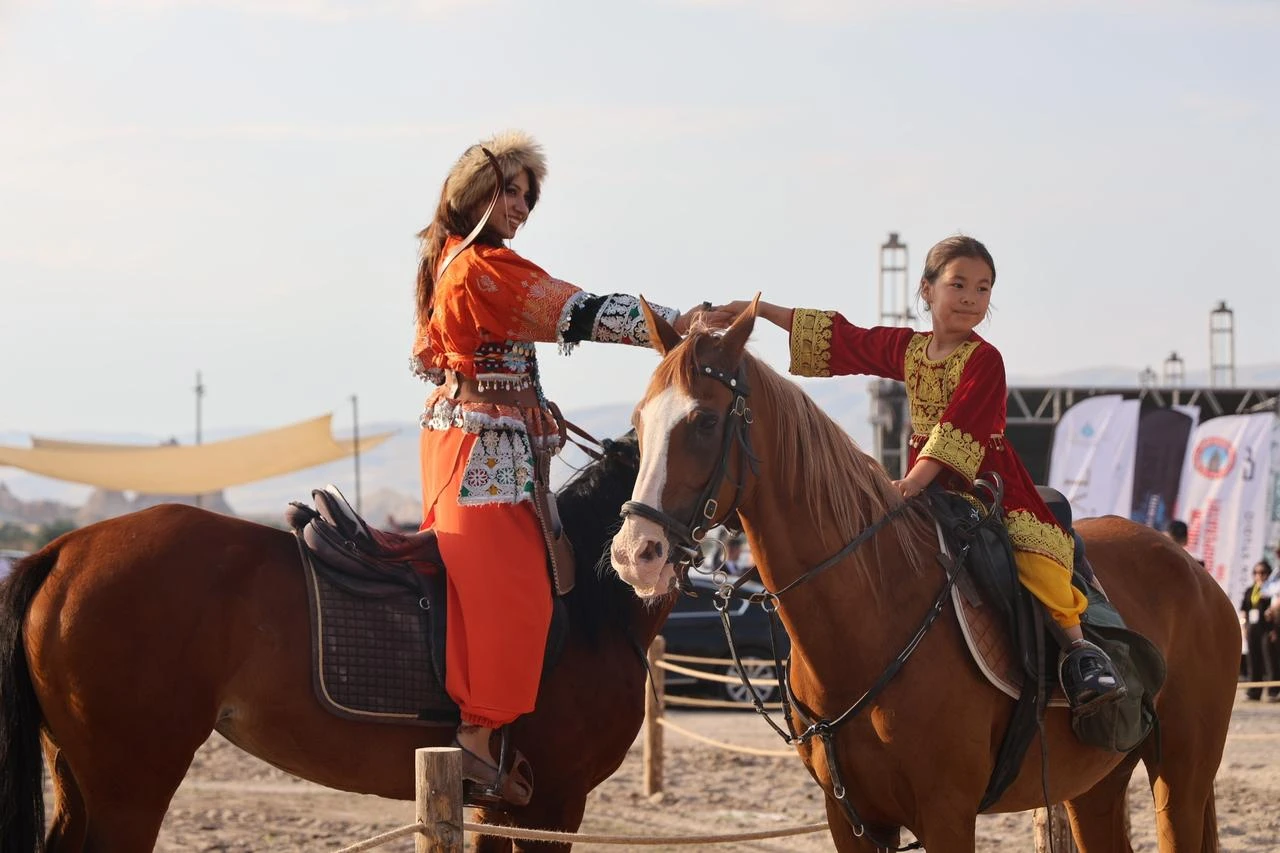Visitors watched horse training demonstrations and equestrian displays against the backdrop of Cappadocia's iconic landscape. Nevsehir, Türkiye, July 3, 2026. (IHA Photo)