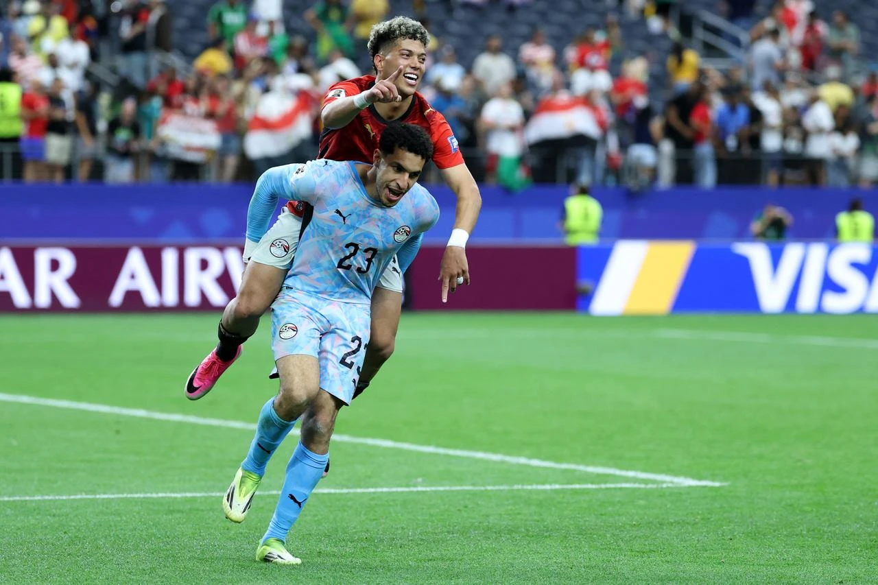 Egypt's goalkeeper #23 Mostafa Shoubir (L) and Egypt's midfielder #08 Emam Ashour celebrate after winning the 2026 World Cup round of 32 football match between Australia and Egypt at the Dallas Stadium in Arlington, July 3, 2026. (AFP Photo)