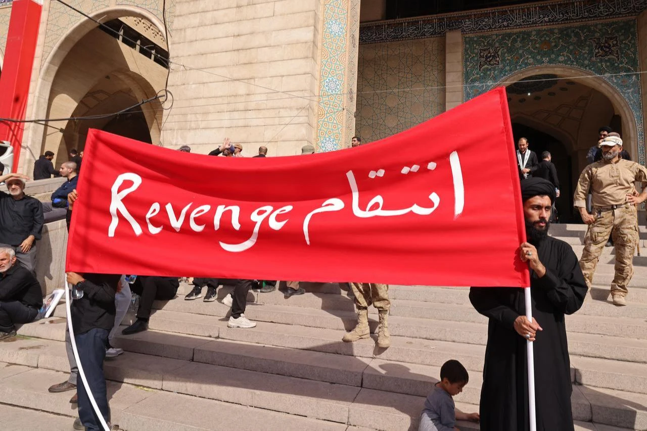 Mourners hold a banner at the Grand Mosalla during the funeral ceremonies of Iran's slain supreme leader Ali Khamenei, in Tehran on July 4, 2026. (AFP Photo)