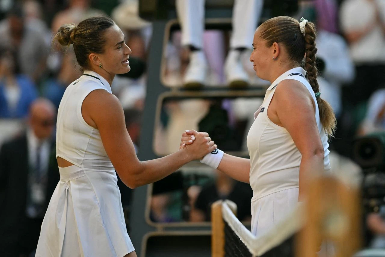 Belarus's Aryna Sabalenka shakes hands with Latvia's Jelena Ostapenko after beating her during their women's singles third round tennis match on the fifth day of the 2026 Wimbledon Championships at The All England Lawn Tennis and Croquet Club in Wimbledon, southwest London, July 3, 2026. (AFP Photo)