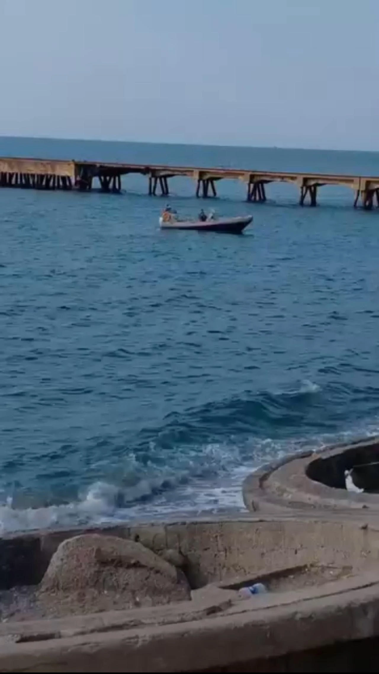 The photo shows a security cordon around the suspected military-grade drone washed ashore on the Black Sea coast in the Filyos district of Zonguldak, Türkiye, July, 5, 2026. (IHA Photo)