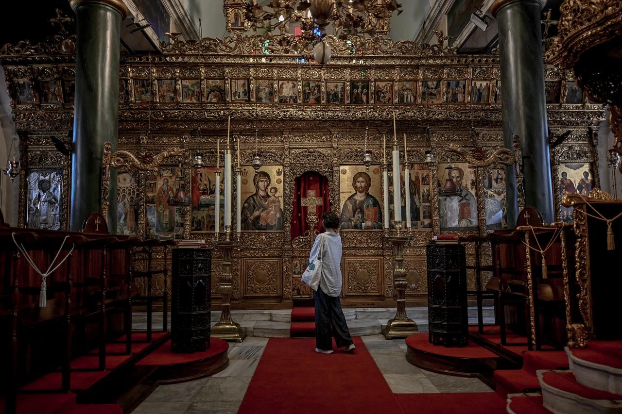 A woman visits a church of the Halki Seminary, the main theological school for the Eastern Orthodox Church until is was closed in 1971, on Princes Islands in Istanbul, Türkiye, July 2, 2026. (AFP Photo)