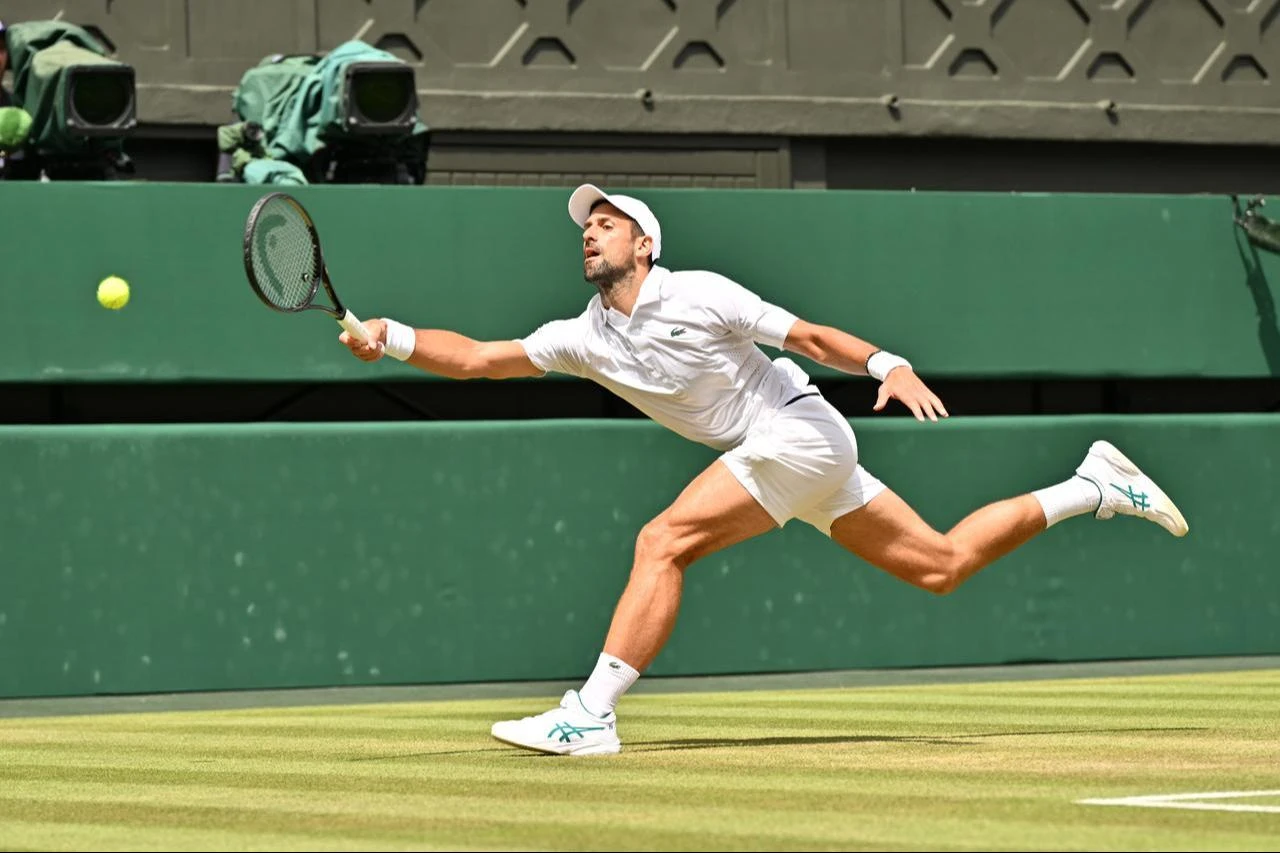 Serbia's Novak Djokovic returns to Russia's Roman Safiullin during their men's singles round of 16 tennis match at The All England Lawn Tennis and Croquet Club in London, England, July 5, 2026. (AA Photo)
