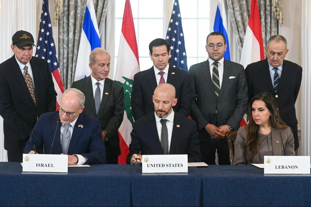 US Secretary of State Marco Rubio (C, back) looks on as (L/R, front row) Israeli Ambassador to the US Yechiel Leiter, State Department Chief of Staff Daniel Holler, and Lebanese Ambassador to the US Nada Hamadeh sign a framework agreement at the US Department of State in Washington, DC, on June 26, 2026. (AFP Photo)