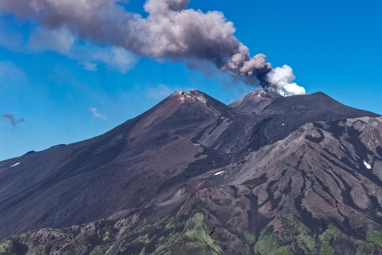 The photograph shows smoke rising from the crater during an eruption of the Mount Etna volcano in Sicily, Italy, on July 5, 2026. (AFP Photo)