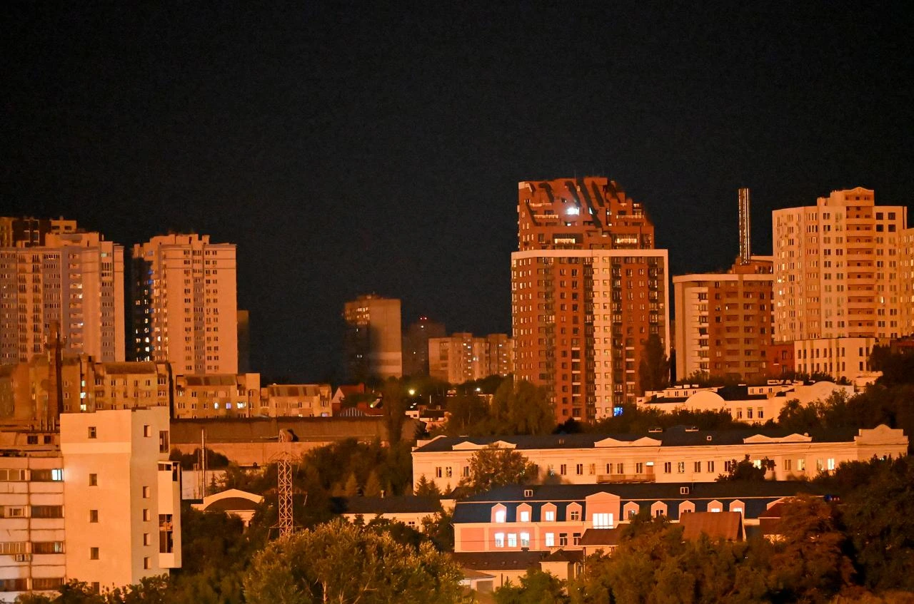 Buildings are illuminated after an explosion during a Russian missile strike on the Ukrainian capital of Kyiv on July 6, 2026. (AFP Photo)