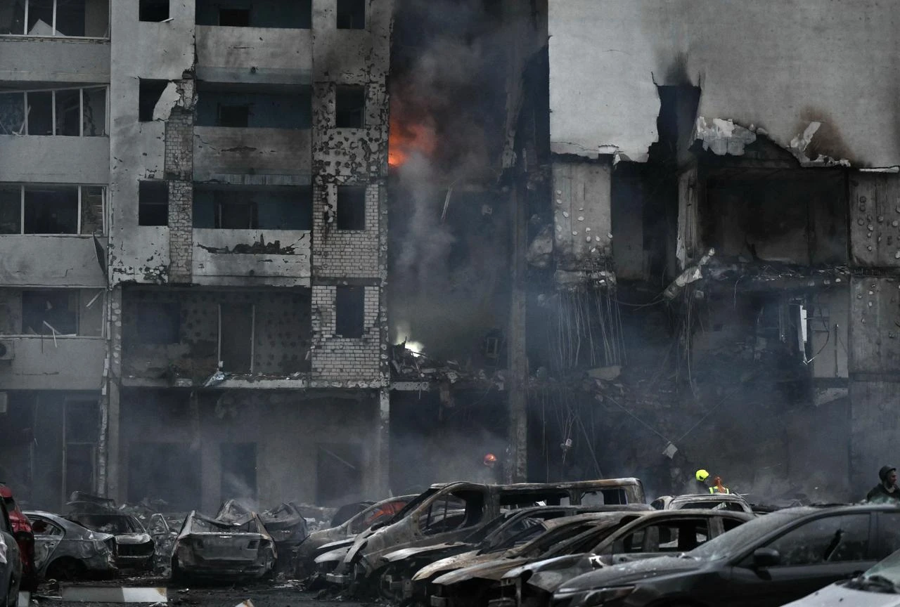 This photograph shows burned cars parked outside a residential building following a Russian missile strike on the Ukrainian capital of Kyiv on July 6, 2026, amid the Russian invasion in Ukraine. (AFP Photo)