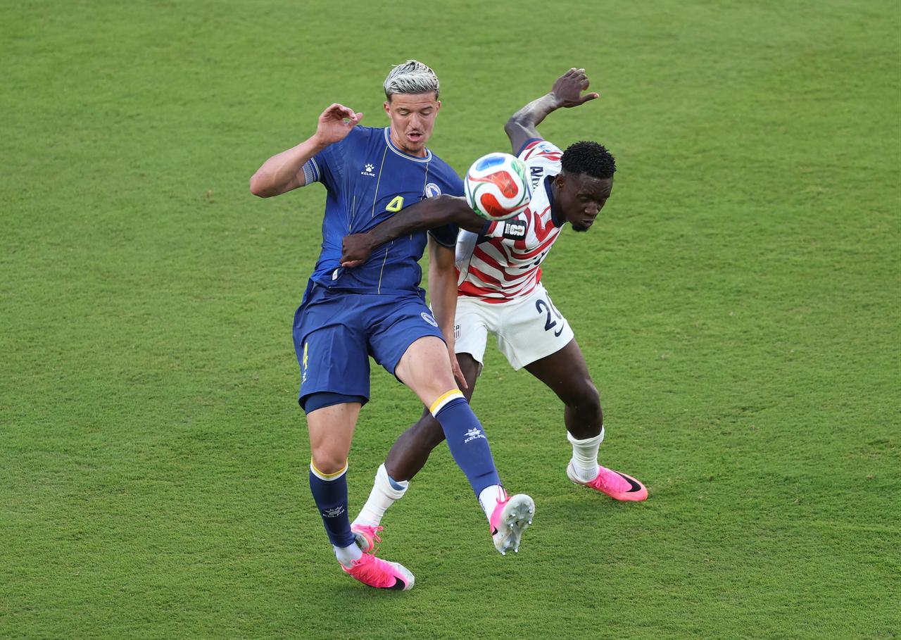 Folarin Balogun #20 of the United States fouls Tarik Muharemovic #4 of Bosnia and Herzegovina and was awarded a red card foul during the match between USA and Bosnia and Herzegovina in California, US, July 01, 2026. (AFP Photo)