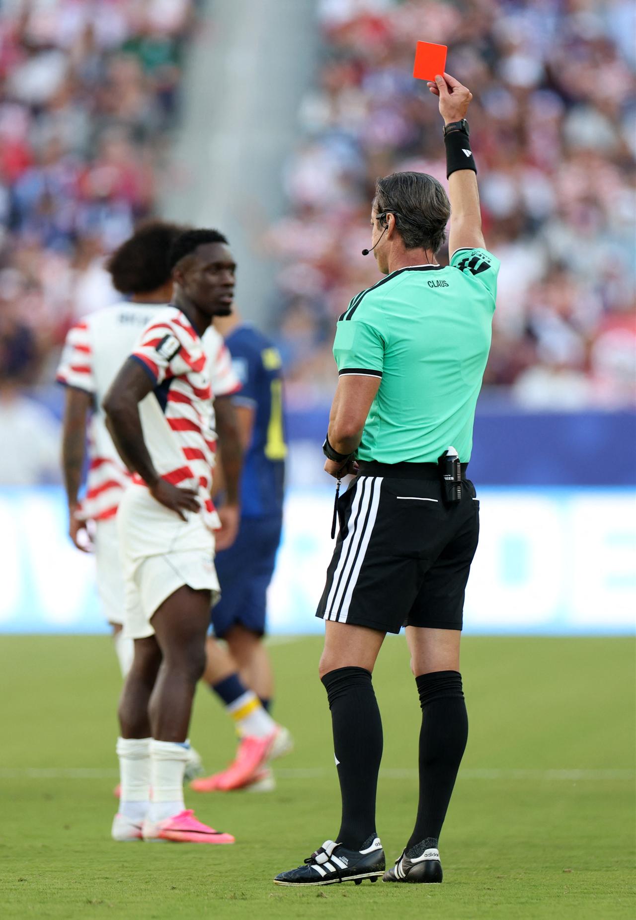 Referee Raphael Claus shows Folarin Balogun #20 of the United States a red card for a foul on Tarik Muharemovic #4 of Bosnia and Herzegovina during the FIFA World Cup 2026 Round of 32 match between USA and Bosnia and Herzegovina at San Francisco Bay Area Stadium in Santa Clara, California, July 01, 2026. (AFP Photo)
