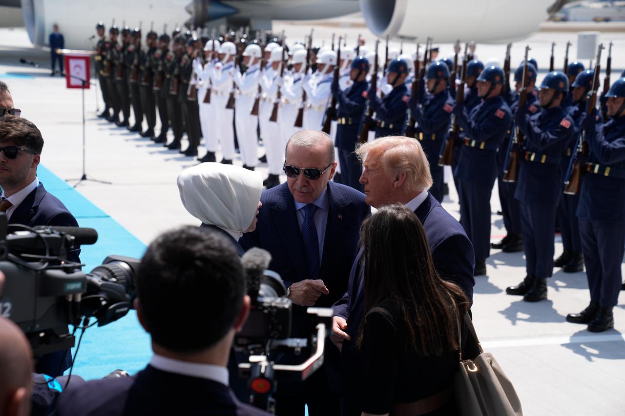 President Recep Tayyip Erdogan (C) speaks with U.S. President Donald Trump (R) upon his arrival at Esenboga Airport in Ankara ahead of the 36th NATO Heads of State and Government Summit, July 7, 2026. (AA Photo)