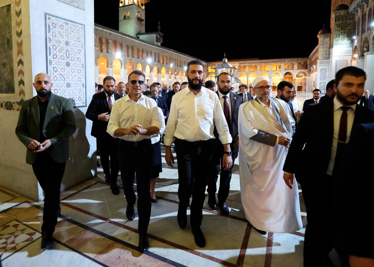France's President Emmanuel Macron (C-L) and Syrian President Ahmed Al-Charaa (C-R) visit the Umayyad Mosque in Damascus, July 6, 2026. (AFP Photo)