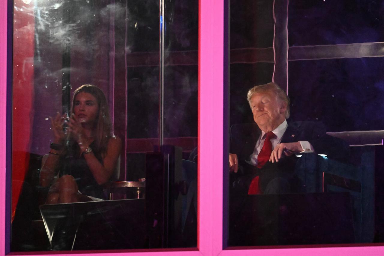 Kai Trump and Donald Trump watch the fireworks display during the "Salute to America" Independence Day celebration on the National Mall in Washington, DC, July 5, 2026. (AFP PHoto)