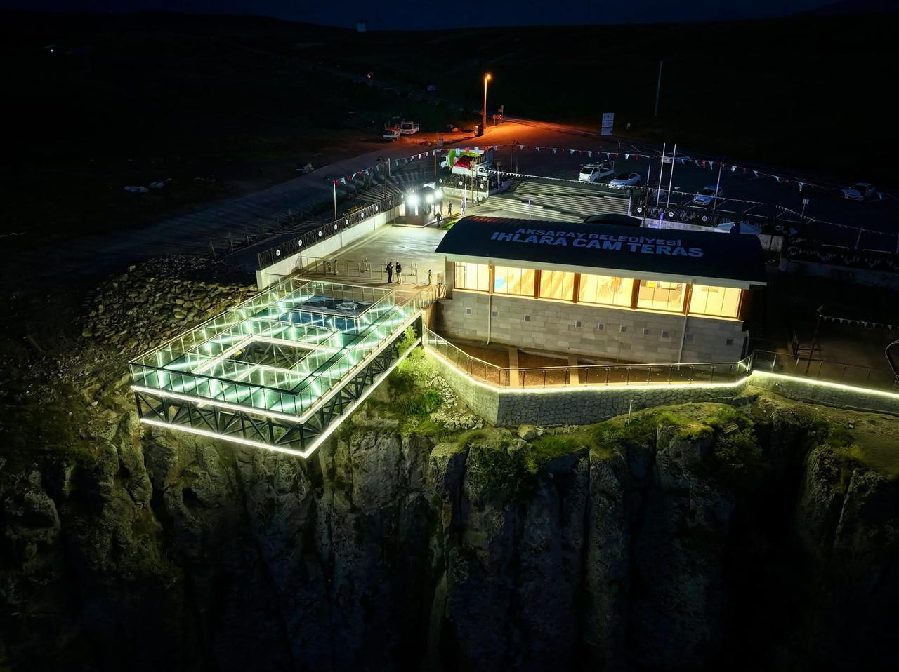 An aerial night view shows the illuminated Ihlara Glass Terrace built above Ihlara Valley in Aksaray, Türkiye. (AA Photo)