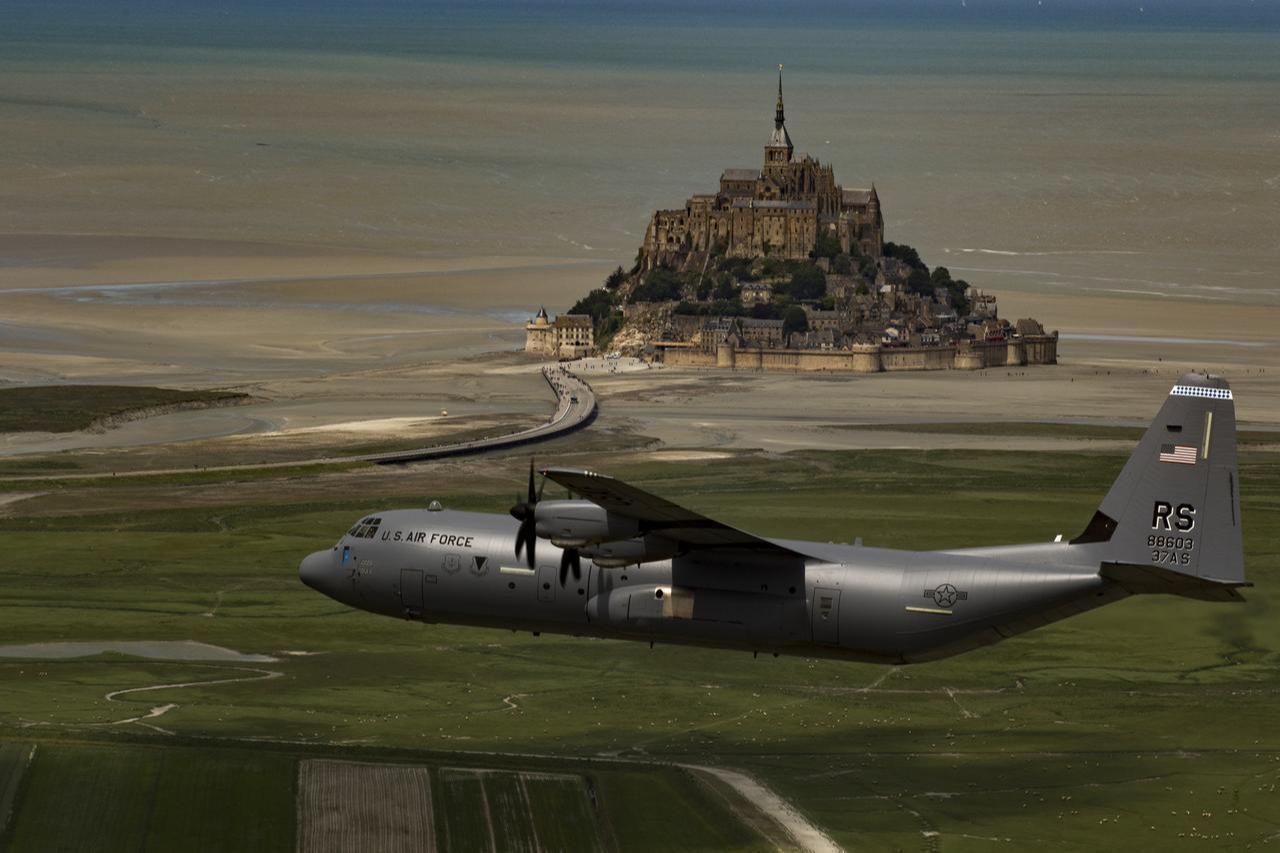 This image features a U.S. Air Force Lockheed Martin C-130J Super Hercules flying past the Mont Saint-Michel abbey in Normandy, France. (Photo via Air Force)