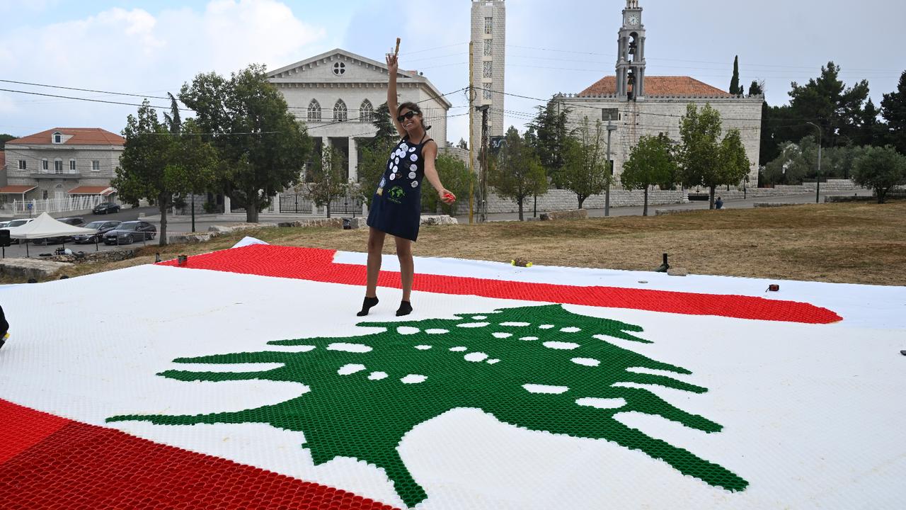 Lebanese activists make massive flag from 140,000 pastic bottle caps