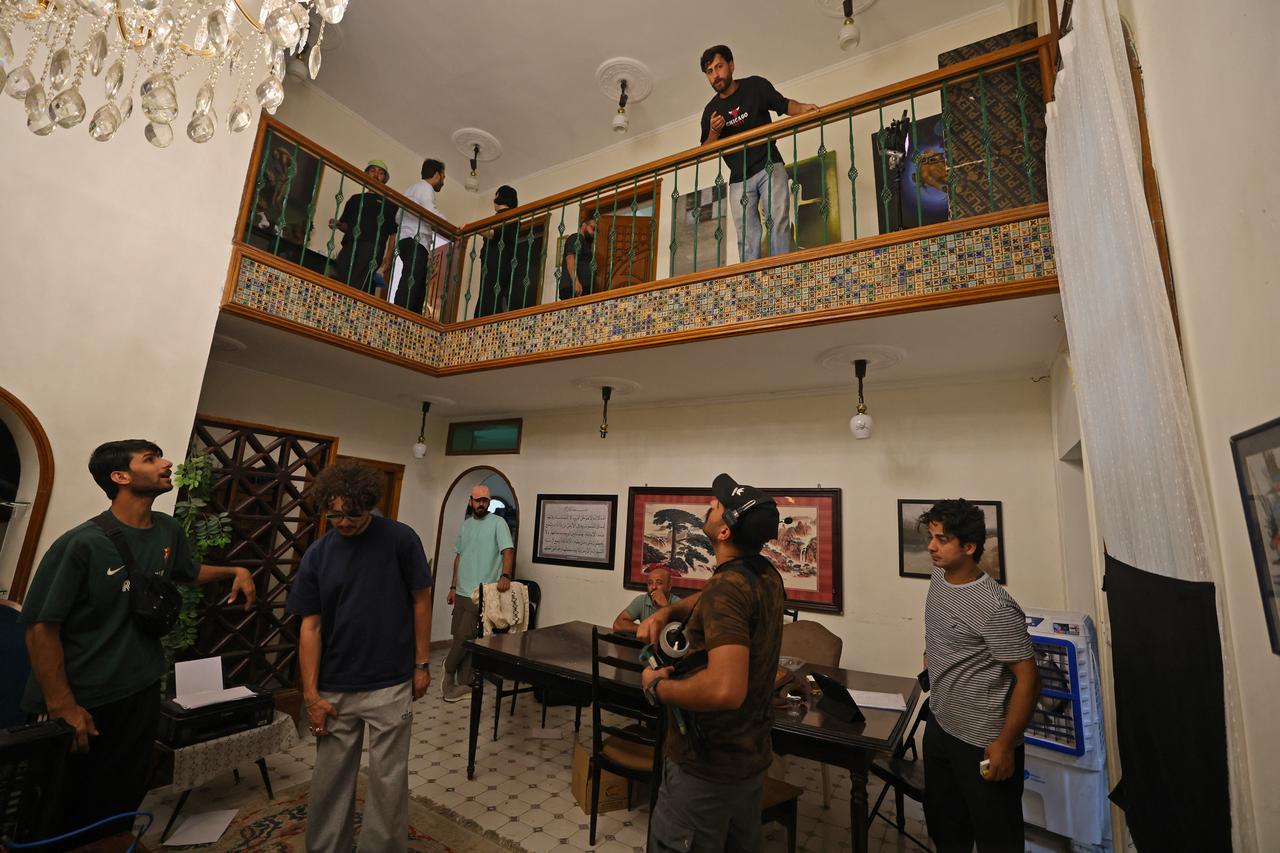 Crew members prepare a set for a scene during the filming of an Iraqi horror movie in the capital Baghdad on June 1, 2026. (AFP Photo)