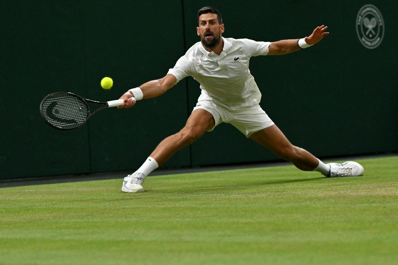 Serbia's Novak Djokovic returns to Canada's Felix Auger-Aliassime during their men's singles quarter-final tennis match on the ninth day of the 2026 Wimbledon Championships at The All England Lawn Tennis and Croquet Club in Wimbledon, southwest London, July 7, 2026. (AFP Photo)