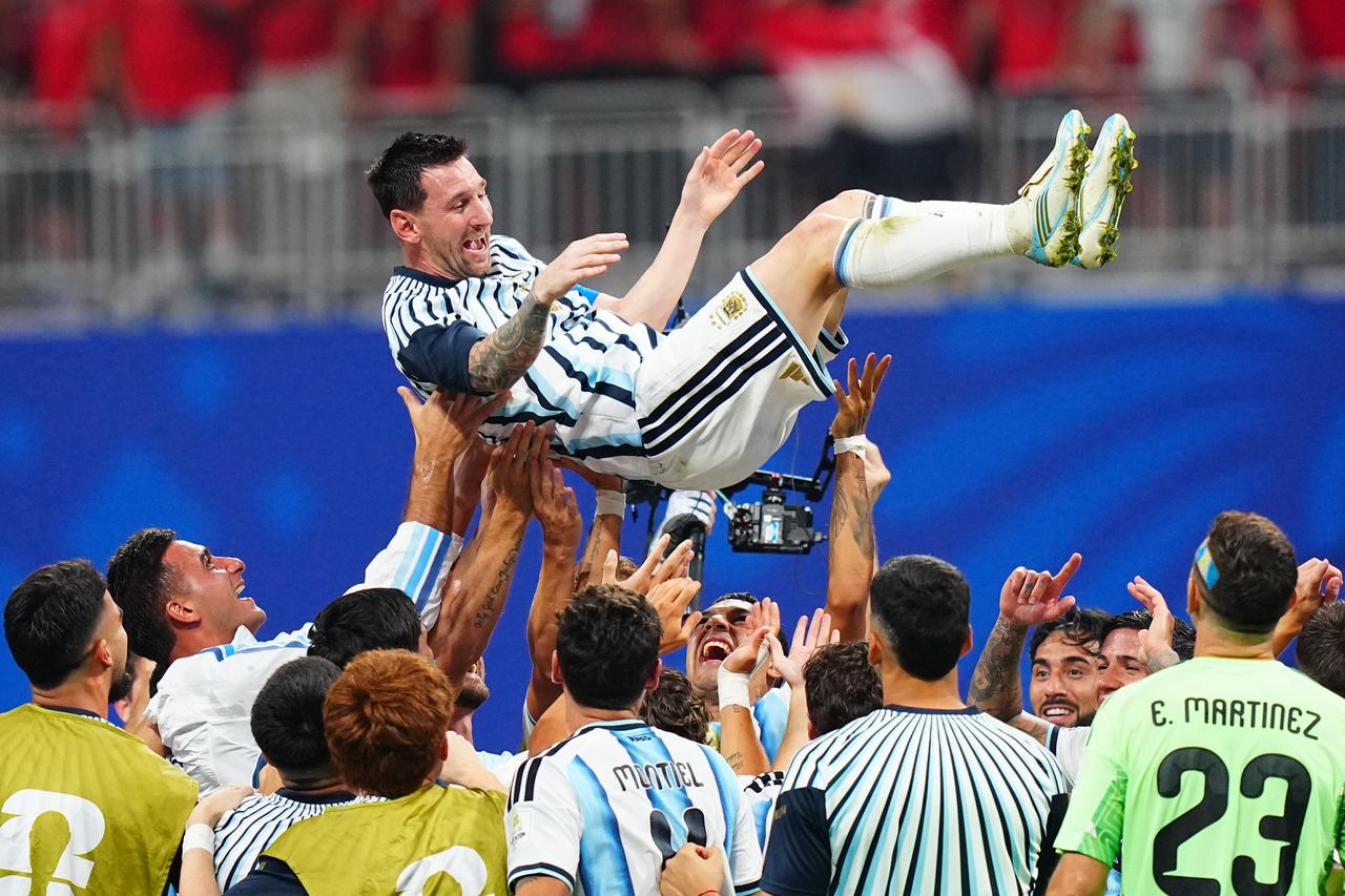 Lionel Messi (10) of Argentina is lifted by teammates as they celebrate after winning the 2026 FIFA World Cup Round of 16 match between Argentina and Egypt at Mercedes-Benz Stadium (Atlanta Stadium) in Atlanta, Georgia, United States, July 7, 2026. (AA Photo)