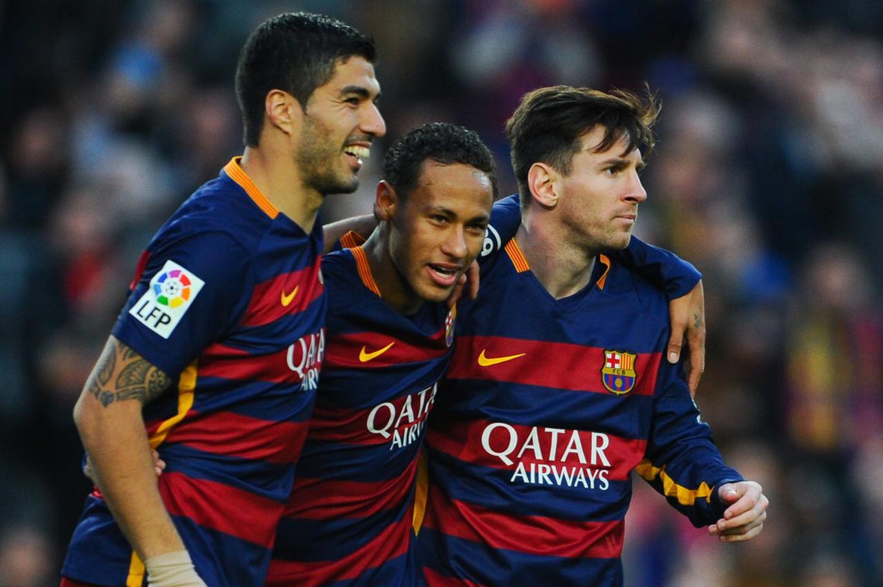 Neymar (C) of FC Barcelona celebrates with his teammates Luis Suarez (L) and Lionel Messi of FC Barcelonaa after scoring his team's third goal of FC Barcelonaduring the La Liga match between FC Barcelona and Real Sociedad de Futbol at Camp Nou on November 28, 2015 in Barcelona, Spain.  (Photo via Getty)
