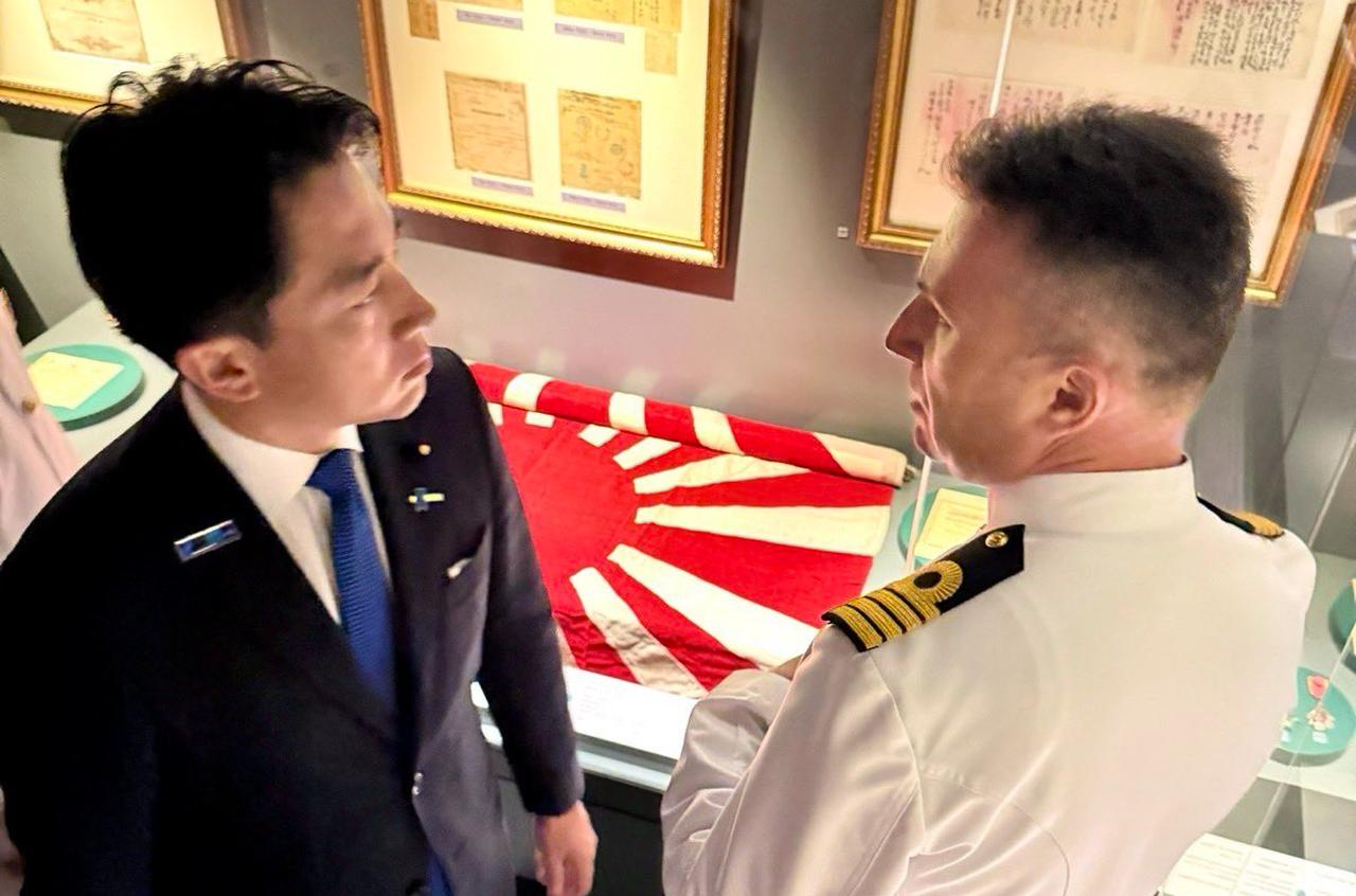 Japanese Defense Minister Shinjiro Koizumi speaks with a Turkish naval officer while touring the Ertugrul Frigate section at the Turkish Naval Museum in Istanbul, Türkiye. (Photo via X/@shinjirokoiz)