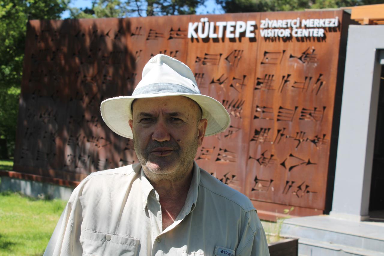 Kultepe excavation head Professor Fikri Kulakoglu poses in front of the Kultepe Visitor Center in Kayseri, Türkiye, July 9, 2026. (IHA Photo)