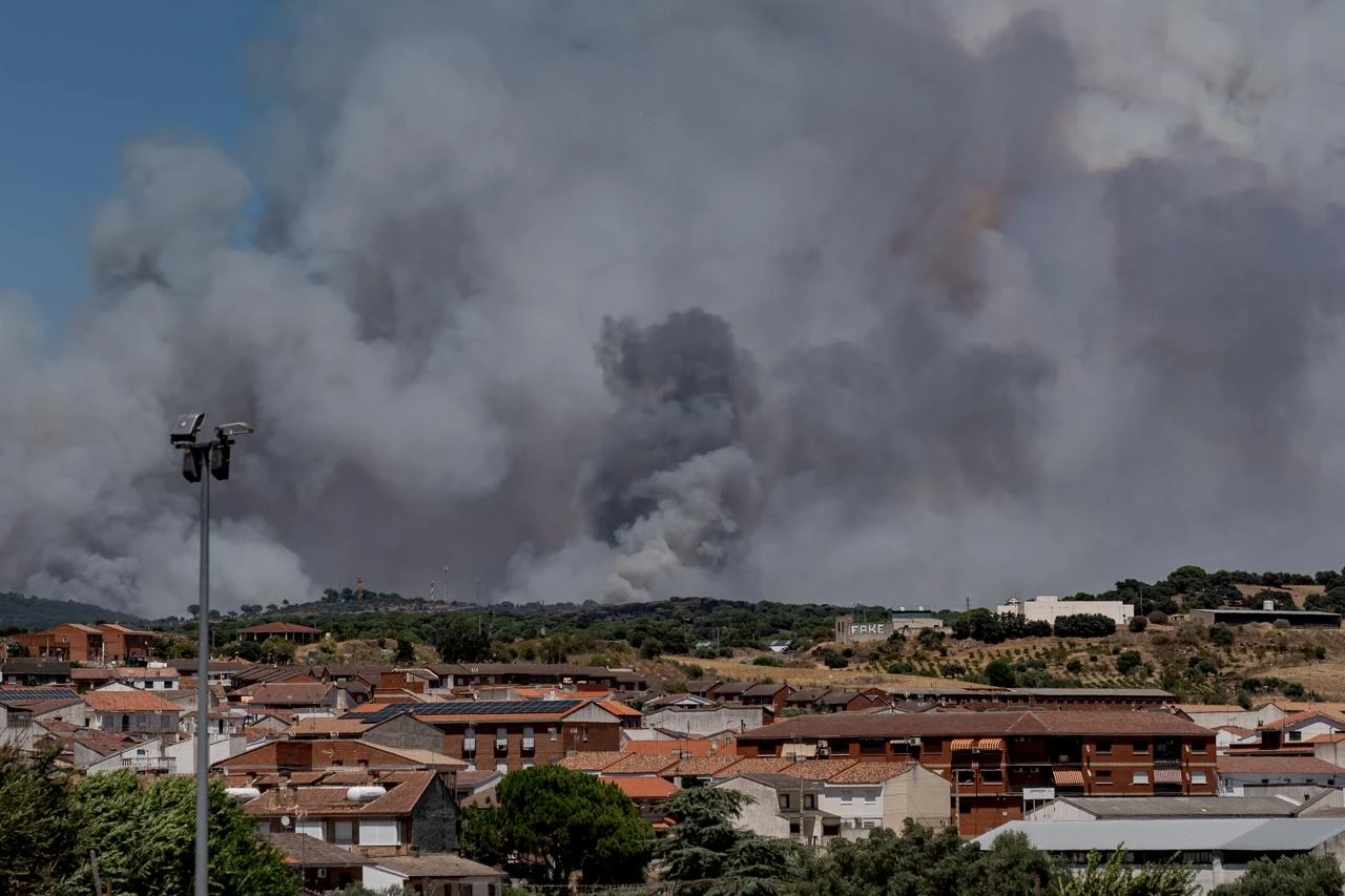 Smoke rises over Avila as a forest fire triggers an extreme alert in central Spain, including Madrid and other nearby regions on July 24, 2026. (AA Photo)