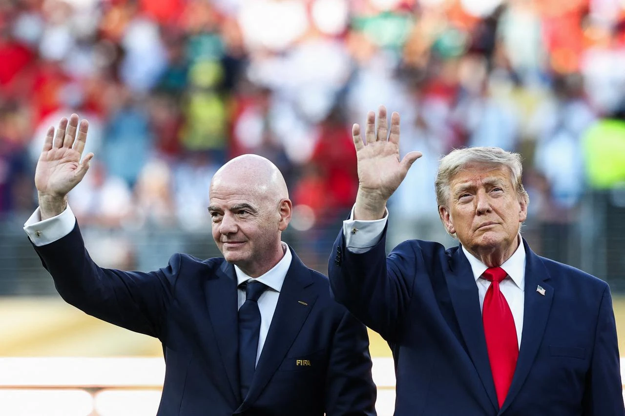 US President Donald Trump (R) and FIFA President Gianni Infantino (L) wave during the award ceremony of the 2026 World Cup football tournament final match between Spain and Argentina at the New York/New Jersey Stadium in East Rutherford, July 19, 2026. (AFP Photo)