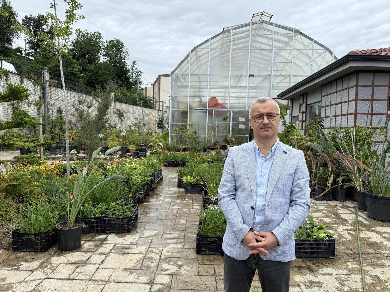 Professor Turan Yuksek, who examined the rare tea tree and its surroundings, poses in Rize, Türkiye. (AA Photo)