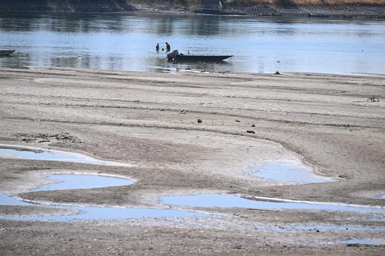 The dried-up Danube riverbed is pictured, near Dunaszentbenedek, close to Paks town on July 31, 2026. (AFP Photo)