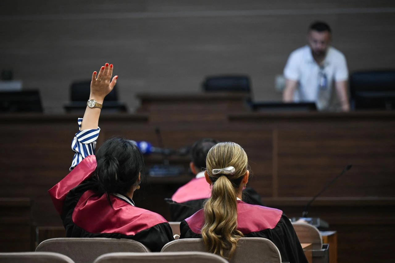 A lawyer confirms her presence during a preliminary hearing in the trial of 21 Serbs, including former top Serbian police officials, over their alleged role in the Recak (Racak in Serbian) massacre, one of the worst crimes against ethnic Albanian civilians during the 1990s war, at the courthouse in Pristina on July 31, 2026. (AFP Photo)