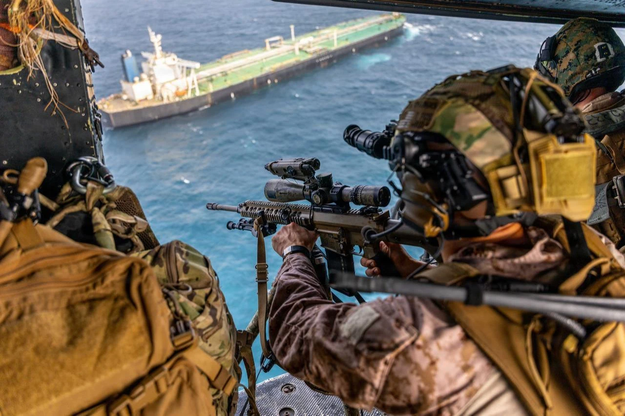 A U.S. Marine sights in on an M110 semi-automatic sniper system during a maritime interception operation in the U.S. Central Command area of responsibility, July 16, 2026. (Photo via U.S. Marine Corps)