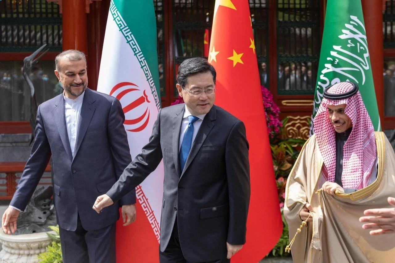 Iran's then-Foreign Minister Hossein Abdollahian (L) walking alongside Saudi Foreign Affairs Minister Prince Faisal bin Farhan Al-Saud (R) and Chinese Foreign Minister Qin Gang at that time during their meeting in Beijing, China, April 6, 2023. (AFP Photo)