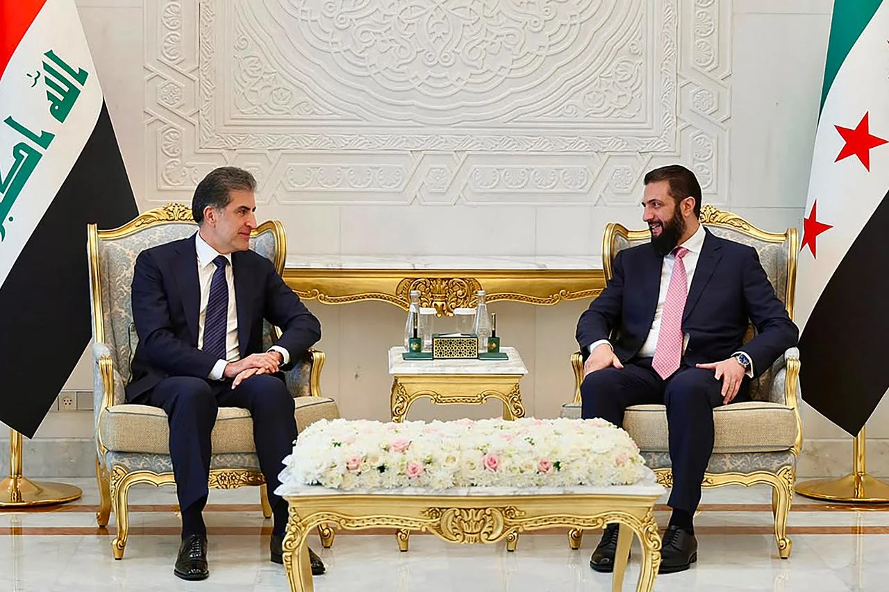 Syria's President Ahmad al-Sharaa (R) speaking with the leader of Iraq's Kurdish region, Nechirvan Barzani, during their meeting in Damascus, August 3, 2026. (AFP Photo/Iraq’s Kurdish Region Presidency/HO)