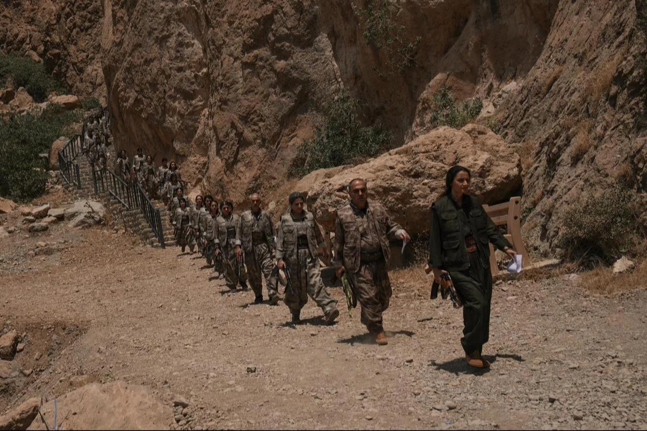 The first group of PKK terrorists lays down and destroys their weapons in Sulaymaniyah, northern Iraq, July 11, 2025. (AA Photo)