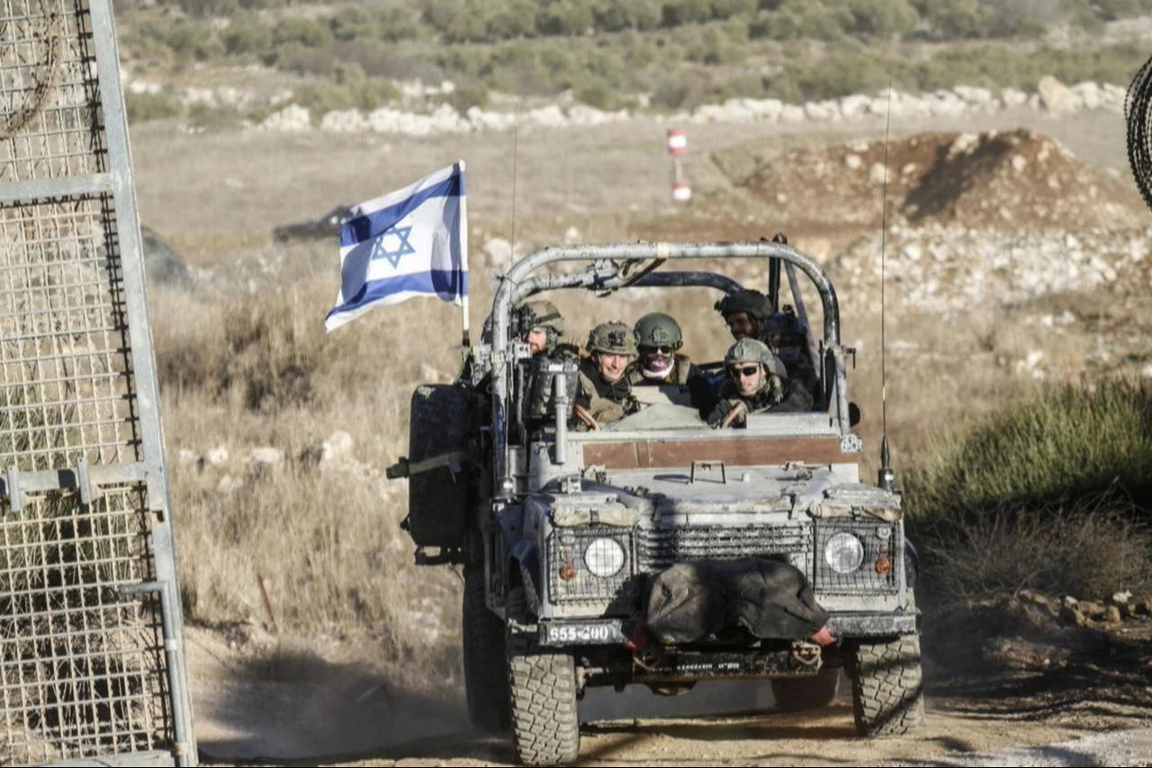 A view of Israeli military vehicles patrolling the Syrian-Israeli border in the Majdal Shams area of the Golan Heights, as the Israeli army reinforces its ground forces amid ongoing military mobilization in the region, Dec. 15, 2024. (AA Photo)
