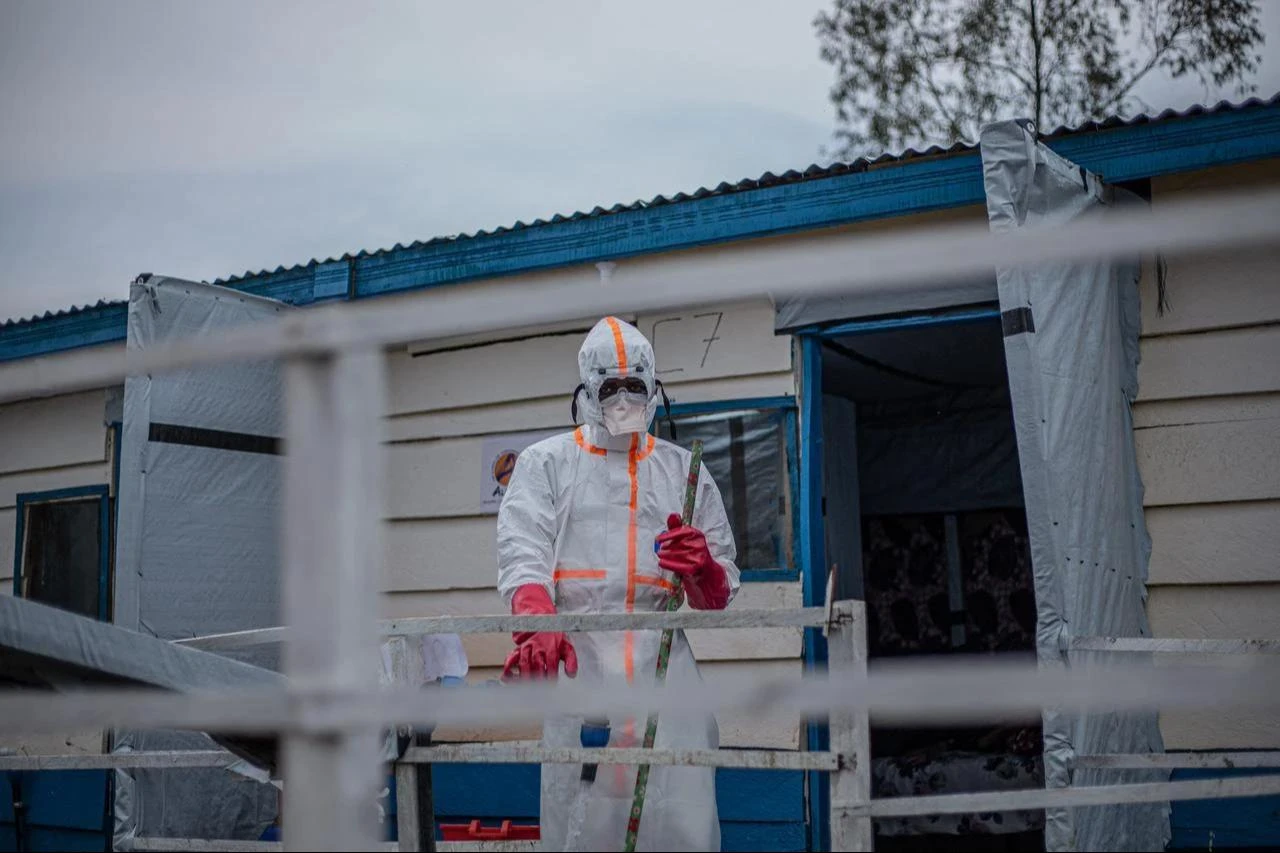 A health worker wearing protective equipment stands outside an isolation ward at an Ebola treatment center in the Democratic Republic of Congo, July 14, 2026. (AFP Photo)