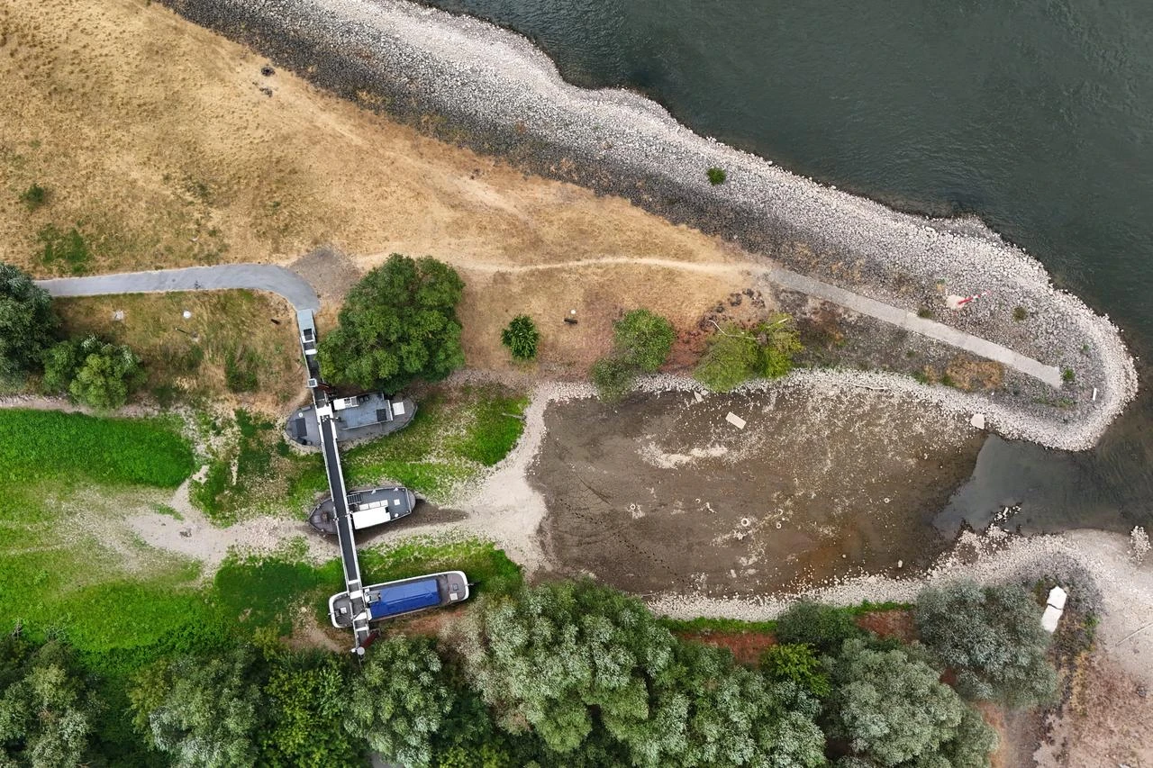 Aerial view shows three former vessels standing on dry land at the old confluence of the River Wupper and the River Rhine near Leverkusen, western Germany, on July 30, 2026. (AFP Photo)