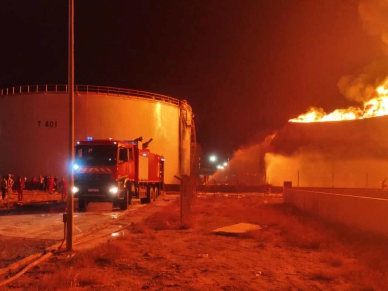 Firefighters and emergency services respond to a blaze that broke out at an oil depot in Zawiya, where clashes between armed groups have intensified in recent days, west of Tripoli, Libya, Aug. 11, 2026. (Libyan National Safety Authority/HO)