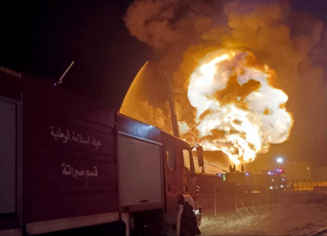 Firefighters and emergency services respond to a blaze that broke out at an oil depot in Zawiya, where clashes between armed groups have intensified in recent days, west of Tripoli, Libya, Aug. 11, 2026. (Libyan National Safety Authority/HO)