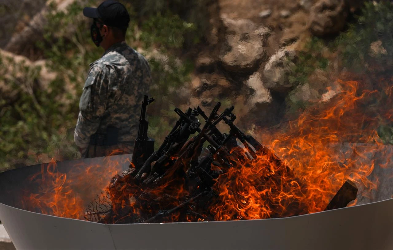The first group of PKK terrorists lays down and destroys their weapons in Sulaymaniyah, northern Iraq on July 11, 2025. (AA Photo)